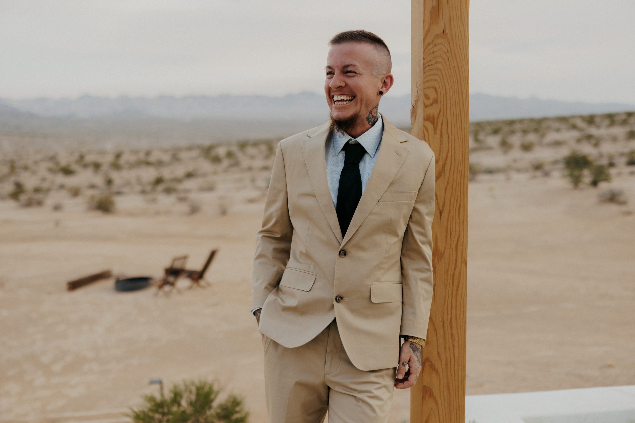 jerek lovey, laughing, in a high-desert landscape
